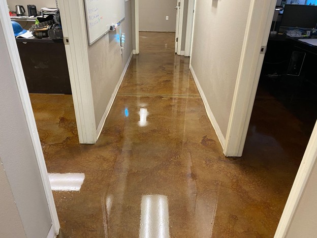 Polished concrete hallway floor with smooth, glossy finish